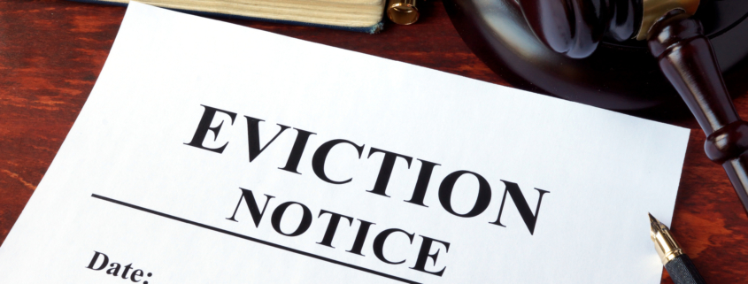 Eviction notice and gavel on a table.