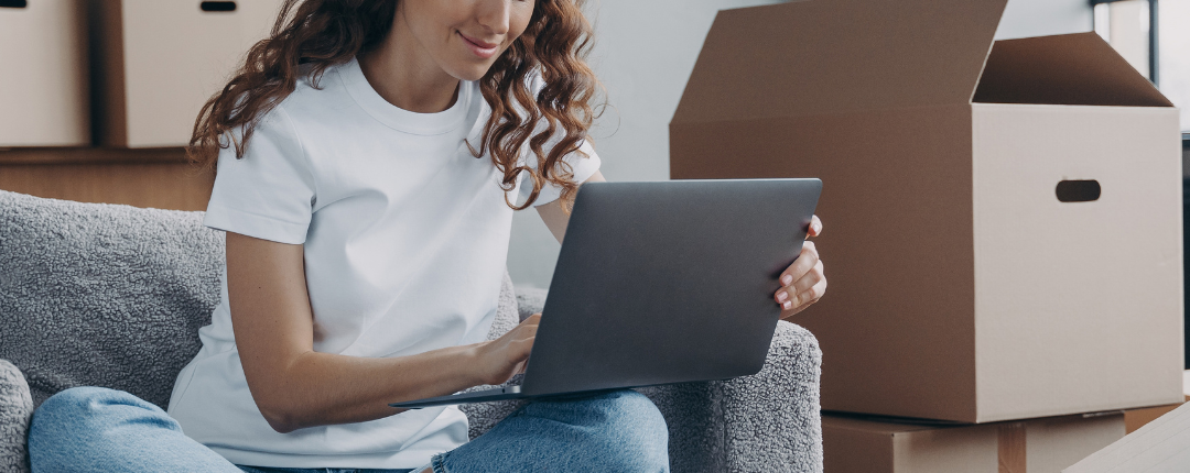Tenant reading legal notice by email while moving into a new apartment in Florida